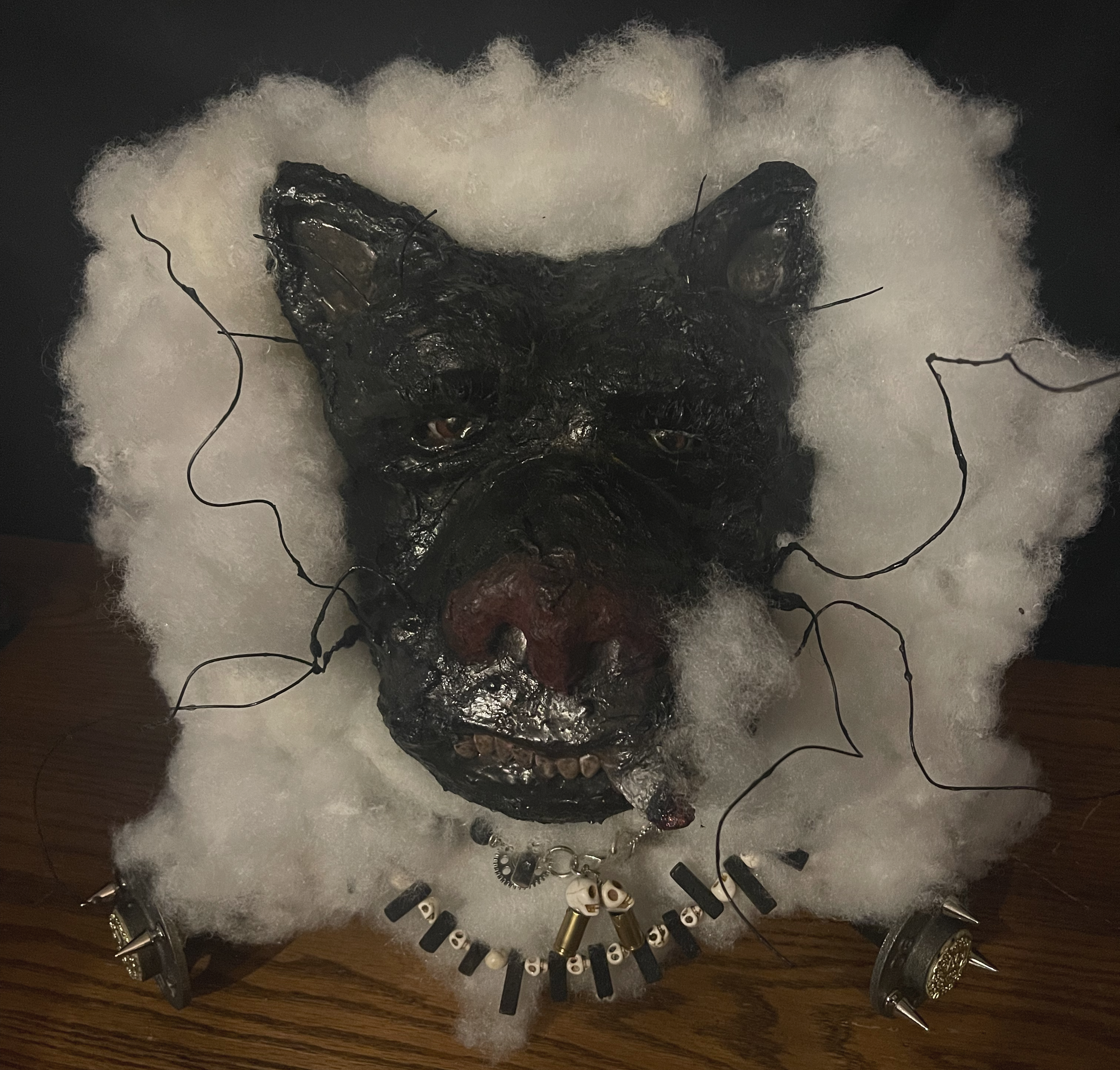 Snoop Panther, a sculptural black panther face surrounded by white fibers